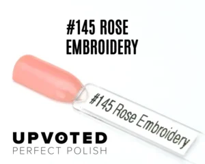 Capsule du vernis semi-permanent NailPerfect Upvoted #145 Rose Embroidery, un rose corail lumineux et raffiné.