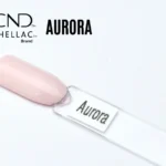 Capsule du vernis semi-permanent professionnel CND™ Shellac Aurora, rose poudré clair et brillant à la finition laquée.
