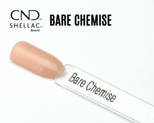 Capsule du vernis semi-permanent CND™ Shellac Bare Chemise, beige nude chaud au fini crème brillant et homogène.