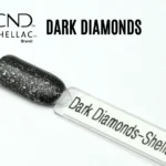 Capsule du vernis semi-permanent professionnel CND™ Shellac Dark Diamonds, noir profond pailleté d’argent à la brillance miroir.