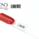 Capsule du vernis semi-permanent professionnel CND™ Shellac Liberté, rouge vif et lumineux, finition brillante effet miroir.
