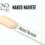 Capsule du vernis semi-permanent professionnel CND™ Shellac Naked Naïveté, beige rosé clair translucide au fini crème brillant et homogène.