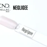 Capsule du vernis semi-permanent professionnel CND™ Shellac Negligee, rose clair translucide aux reflets nacrés doux et brillance satinée.