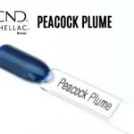 Capsule du vernis semi-permanent professionnel CND™ Shellac Peacock Plume, bleu nuit profond aux reflets irisés métalliques.