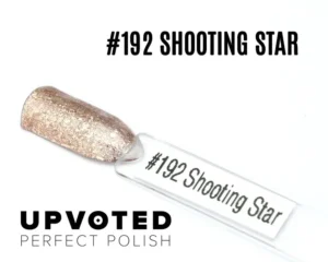 Capsule du vernis semi-permanent NailPerfect Upvoted #192 Shooting Star, un champagne rosé pailleté raffiné et éclatant.