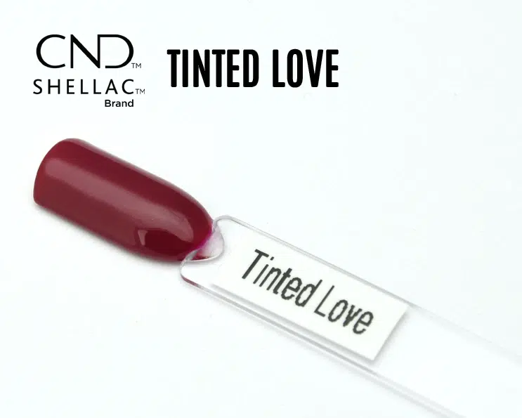 Capsule du vernis semi-permanent professionnel CND™ Shellac Tinted Love, rouge prune profond et brillant à la finition laquée.