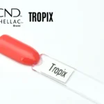 Capsule du vernis semi-permanent professionnel CND™ Shellac Tropix, corail orangé lumineux à la finition brillante effet miroir.