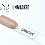 Le visuel montre la capsule du vernis CND™ Shellac Unmasked, beige taupe au fini crème et brillant.