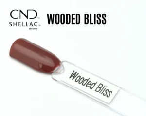 Le visuel montre la capsule du vernis CND™ Shellac Wooded Bliss, brun rosé boisé au fini crème et brillant.