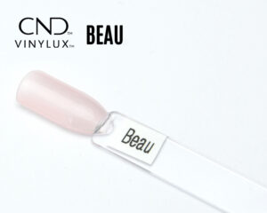 Capsule du vernis CND™ VINYLUX™ Beau – rose clair semi-opaque, finition brillante naturelle et élégante.