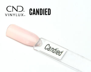Capsule du vernis CND™ VINYLUX™ Candied – rose pastel semi-opaque au fini laiteux.