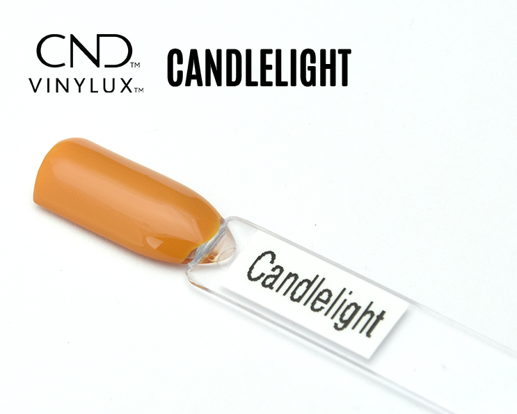Capsule du vernis CND™ VINYLUX™ Candlelight – orangé ambre opaque, finition crème.