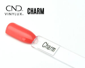 Capsule du vernis CND™ VINYLUX™ Charm – corail rosé opaque, finition crème brillante.
