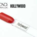 Capsule du vernis CND™ VINYLUX™ Hollywood, un rouge rosé lumineux au fini nacré opaque, scintillant et uniforme, illustrant fidèlement la teinte glamour du vernis.