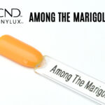 Capsule du vernis CND™ VINYLUX™ Among The Marigolds – orange chaud opaque, finition crème brillante.