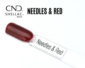 Capsule du vernis semi-permanent professionnel CND™ Shellac Needles & Red, rouge translucide profond agrémenté de fines paillettes sombres pour un rendu scintillant et élégant.
