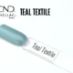 Capsule du vernis semi-permanent professionnel CND™ Shellac Teal Textile, bleu-vert nacré au fini brillant et métallisé.