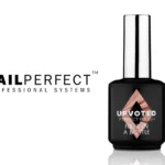 Flacon du Fiber in a Bottle NailPerfect Pink Velour (15 ml), au design professionnel noir brillant avec étiquette claire. Présenté sur fond neutre, il met en valeur la teinte rose nude velours du gel et souligne la mention « Fiber in a Bottle » gage de renfort et qualité.