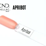Capsule du vernis semi-permanent professionnel CND™ Shellac Apribot, teinte abricot pastel lumineuse à la finition brillante et naturelle.