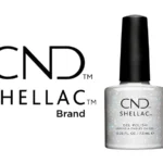 Vernis semi-permanent CND™ Shellac Ice Vapor (7,3 ml) – transparent à paillettes argentées, effet givré lumineux. Tenue jusqu’à 3 semaines, brillance miroir, dépose douce. Disponible à 15,90 € sur RBBE.fr.